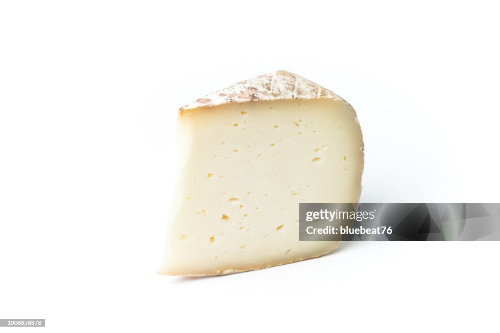 Close-Up Of Cheese Slice Against White Background