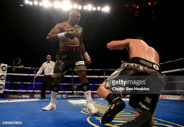 Dillian Whyte knocks down Joseph Parker during the Heavyweight fight between Dillian Whyte and Joseph Parker at The O2 Arena on July 28, 2018 in...