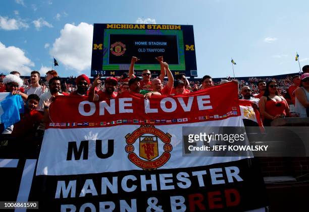 Manchester United fans cheer before their game against the Liverpool FC during the 2018 International Champions Cup football match at Michigan...