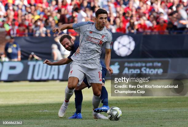 Marko Grujic of Liverpool advances the ball in front of Juan Mata of Manchester United in the second half during the International Champions Cup 2018...