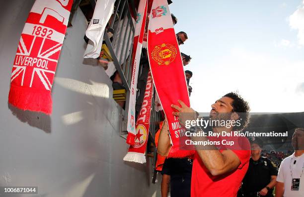 Mohamed Salah of Liverpool signs autographs after a 4-1 win over Manchester United during the International Champions Cup 2018 match at Michigan...