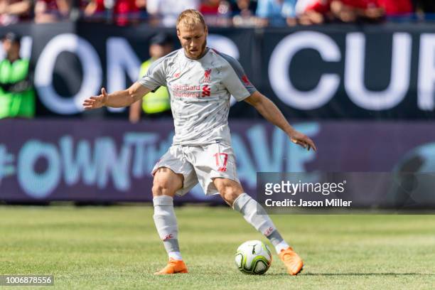 Ragnar Klavan of Liverpool passes against the Manchester United during first half of the International Champions Cup 2018 at Michigan Stadium on July...
