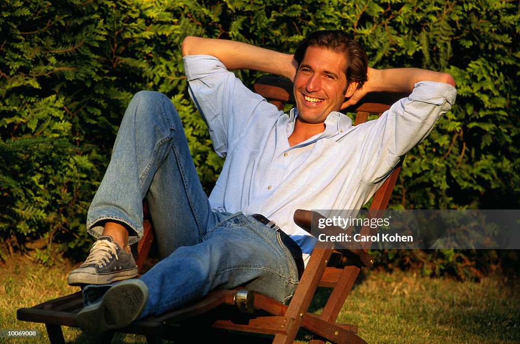 MAN RELAXING IN THE GARDEN