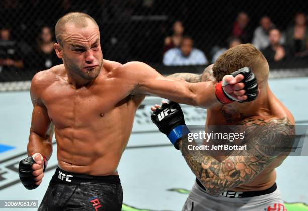 Eddie Alvarez lands a spinning back fist against Dustin Poirier in their lightweight bout during the UFC Fight Night event at Scotiabank Saddledome...