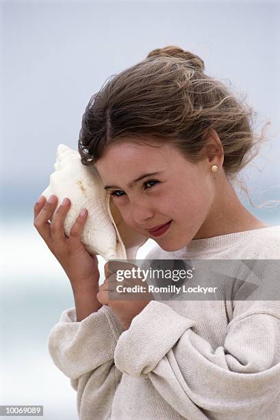 Listen Sea Shell Photos and Premium High Res Pictures - Getty Images