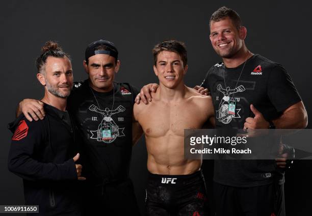Alexander Hernandez poses for a portrait backstage with his team after his victory over Olivier Aubin-Mercier during the UFC Fight Night event at...
