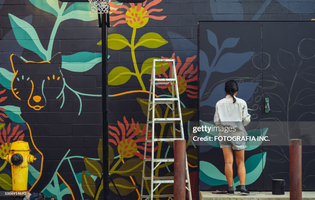 Mural artist at work