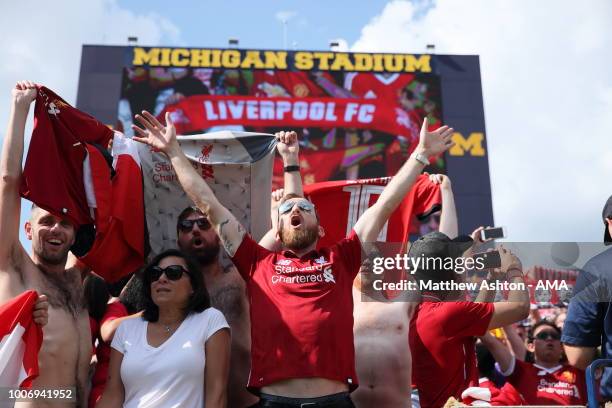 Fans of Liverpool hold up scarfs whilst singing You'll Never Walk Alone during the International Champions Cup 2018 match between Manchester Untied...