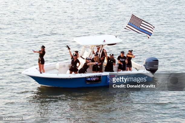 Boat 240, COPS TV show participates in the Ocean City Nitght In Venice Boat Parade at Back Bay of Ocean City on July 28, 2018 in Ocean City, New...