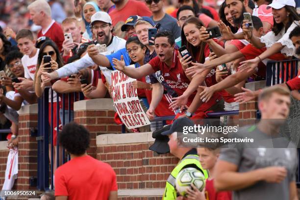 Fans cheer and try to get the attention of Liverpool Forward Mohamed Salah during the ICC soccer match between Manchester United FC and Liverpool FC...