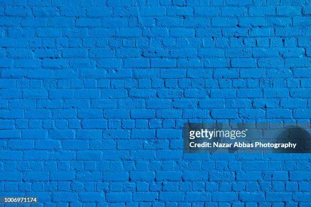 blue brick wall background. - wall foto e immagini stock