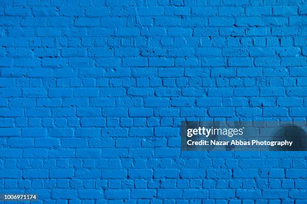 blue brick wall background. - wall stockfoto's en -beelden