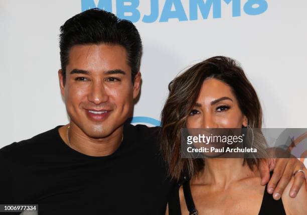Personality Mario Lopez and Actress Courtney Laine Mazza attend the 2nd annual MBJAM18 presented by Michael B. Jordan and Lupus LA at Dave & Buster's...