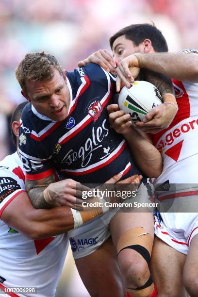 Jake Friend of the Roosters is tackled during the round 20 NRL match between the Sydney Roosters and the St George Illawarra Dragons at Allianz...