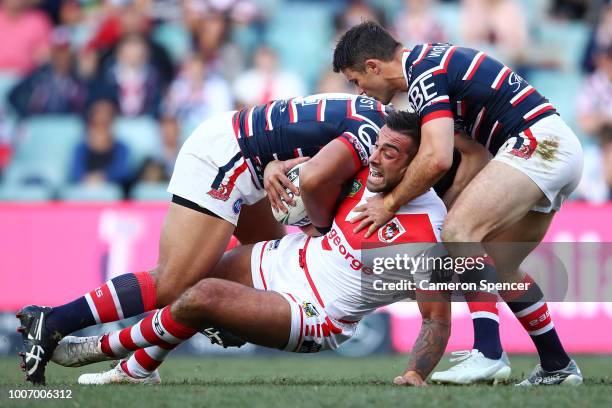 Paul Vaughan of the Dragons is tackled during the round 20 NRL match between the Sydney Roosters and the St George Illawarra Dragons at Allianz...
