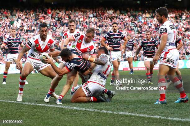 James Tedesco of the Roosters is held up short as he attempts to score a try during the round 20 NRL match between the Sydney Roosters and the St...