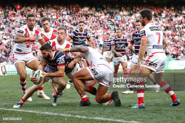 James Tedesco of the Roosters is held up short as he attempts to score a try during the round 20 NRL match between the Sydney Roosters and the St...