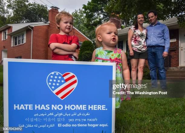 The Thompson family of Arlington react to KKK flyers by posting their own signs in opposition on July 2018 in Arlington, VA. From left are Bennett-3,...