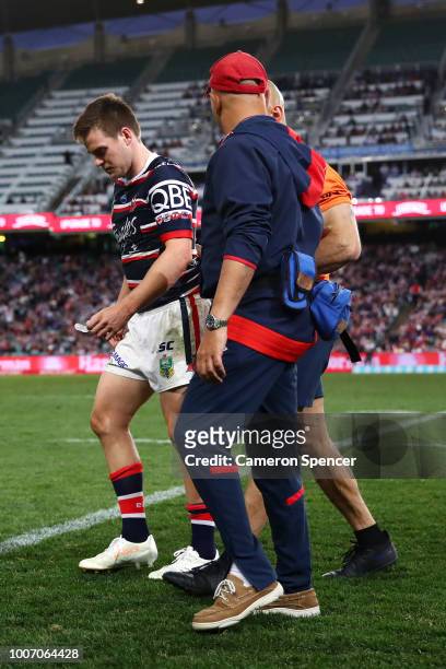 Luke Keary of the Roosters leaves the field injured during the round 20 NRL match between the Sydney Roosters and the St George Illawarra Dragons at...
