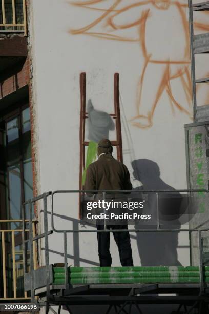 Street artist Jorit Agoch at work on a graffiti mural. The Neapolitan street artist Jorit Agoch was arrested by the Israeli police in Bethlehem....