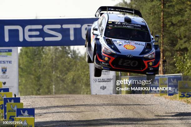 Belgian driver Thierry Neuville and co-driver Nicolas Gilsoul get airborne with their Hyundai i20 WRC car during the Ruuhimäki 1 Special Stage of the...