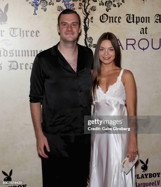 Playboy Chief Creative Officer Cooper Hefner and actress Scarlett Byrne arrive at Playboy's Midsummer Night's Dream at the Marquee Nightclub at The...