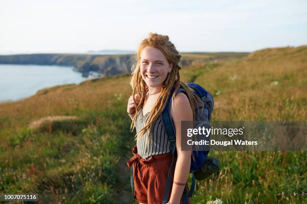 portrait of female hiker on atlantic coastline. - gap year stock pictures, royalty-free photos & images