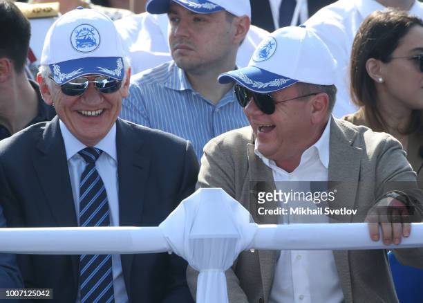 Russian billionaires and businessmen Gennady Timchenko and Russian jazz saxophonist Igor Butman attend the Navy Day Parade on July 29, 2018 in Saint...