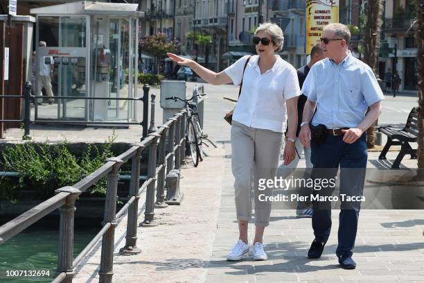 British Prime Minister Theresa May, walks with her husband Philip whilst on vacation in Italy, July 29, 2018 in Desenzano del Garda, Italy.