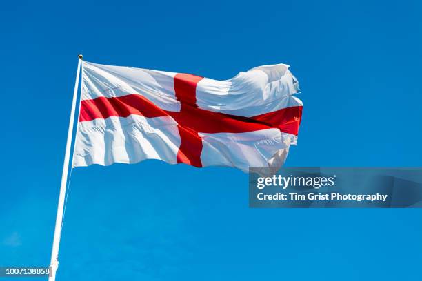 st george cross flag of england against a blue sky - england flag foto e immagini stock