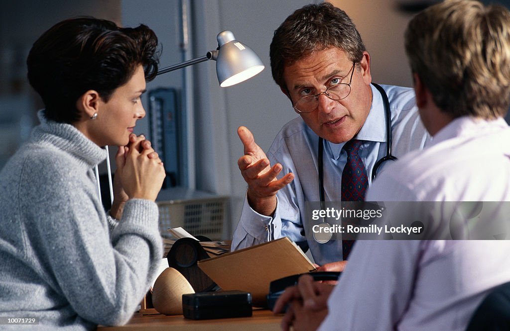 COUPLE CONSULTING WITH DOCTOR