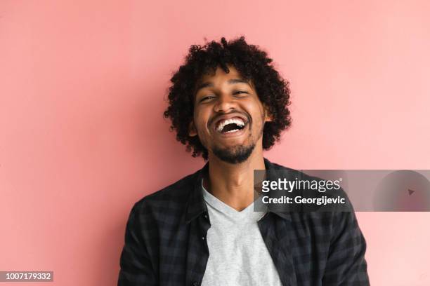 casual guy - afro hairstyle stock pictures, royalty-free photos & images