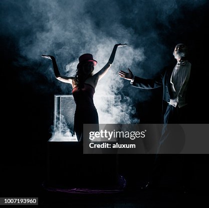 Magician performance. Disappearance trick Magician performance. Disappearance trick