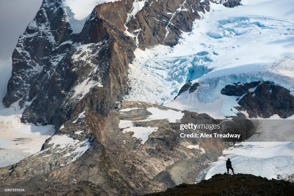 Trekking in the Swiss Alps near Zermatt with a view of Monte Rosa, Zermatt, Valais, Switzerland, Europe