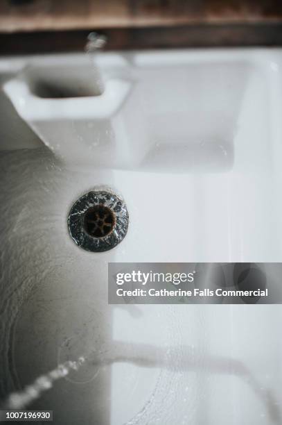 belfast sink with running water tap - sink stock pictures, royalty-free photos & images