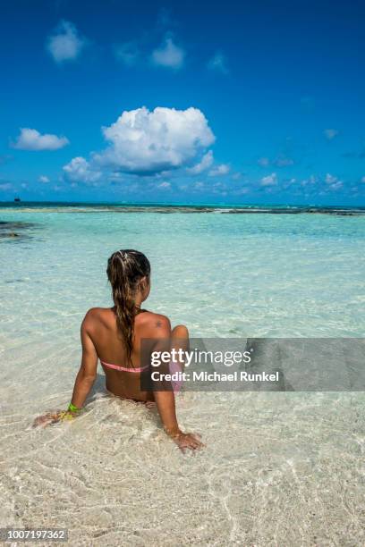 girl enjoying the beautiful water of el acuario, san andres, caribbean sea, colombia, south america - acuario stock-fotos und bilder