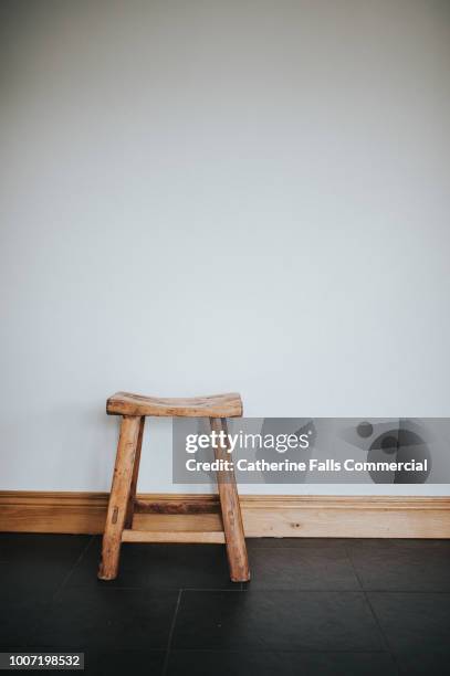 little wooden stool - taburete fotografías e imágenes de stock