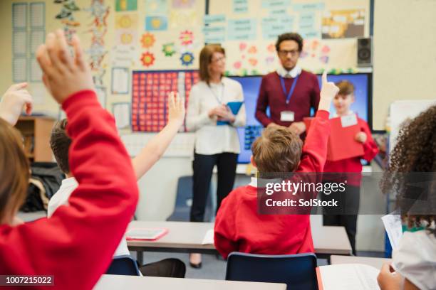 schoolboy presenting to his elementary class - inclusive classroom stock pictures, royalty-free photos & images