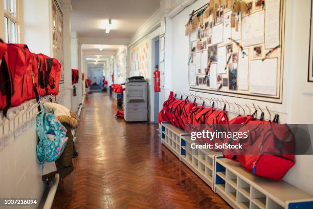 elementary school corridor - satchel bag stock pictures, royalty-free photos & images