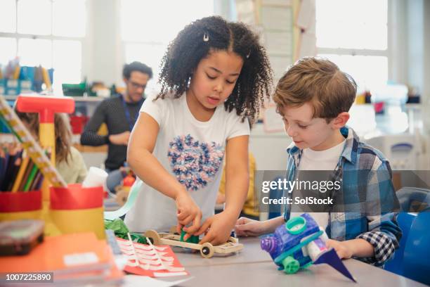 building with friends in elementary class - schoolboy stock pictures, royalty-free photos & images