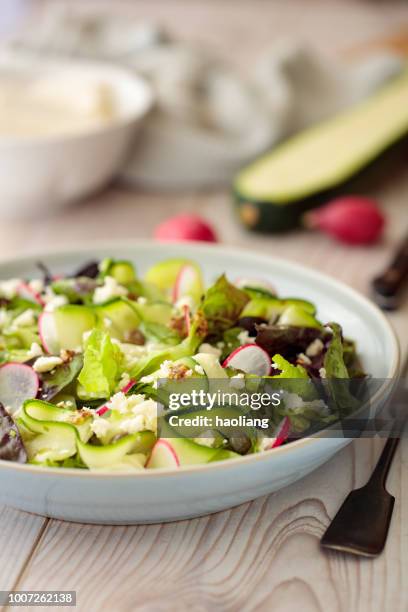 healthy summer courgette salad - radish vinaigrette stock pictures, royalty-free photos & images