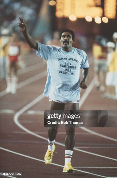 English decathlete Daley Thompson of the Great Britain team salutes the crowd after crossing the finish line in 14th place in the 1500 metres race,...