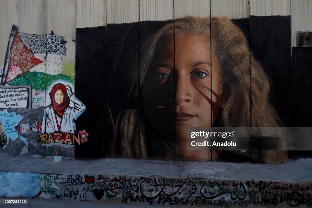 Israel detains Italian artists for jailed Tamimi mural