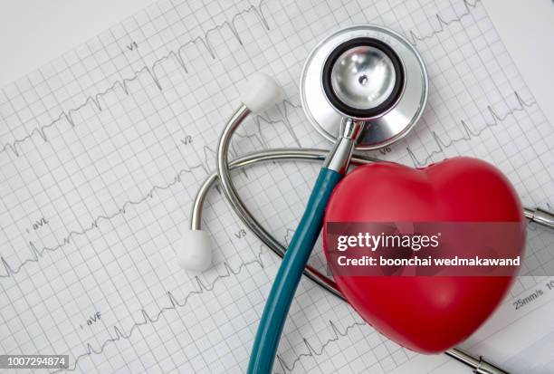 heart ,stethoscope on cardiogram report of cardiology patient. cardiologist and medical concept - stethoscope heart stock-fotos und bilder