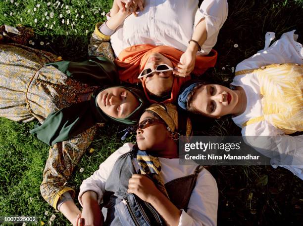 the new mods - muslim women group stock pictures, royalty-free photos & images