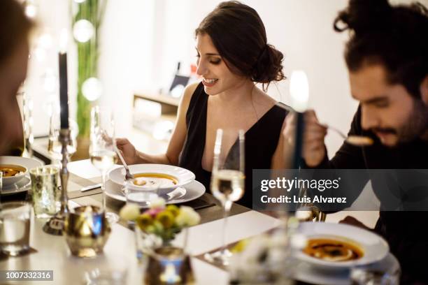 woman having squash soup at dining table - burns supper stock pictures, royalty-free photos & images