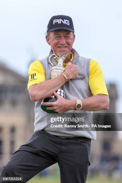 Spain's Miguel Angel Jimenez celebrates with the trophy after winning the Senior Open at Old Course St Andrews.