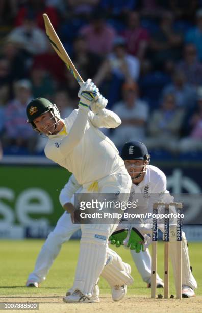 Michael Clarke of Australia hits out and is caught for 38 runs by Moeen Ali of England off his own bowling during the 1st Ashes Test match between...