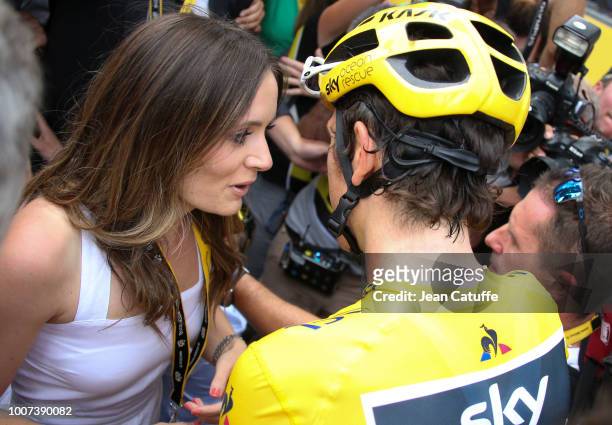 Winner of the Tour yellow jersey Geraint Thomas of Great Britain and Team Sky celebrates with his wife Sara Elen Thomas following stage 21 of Le Tour...