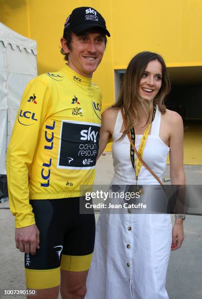 Winner of the Tour yellow jersey Geraint Thomas of Great Britain and Team Sky celebrates with his wife Sara Elen Thomas following stage 21 of Le Tour...